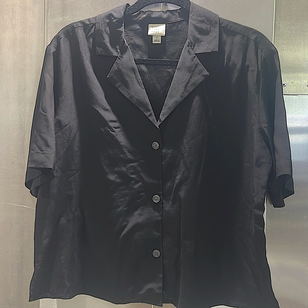 A • new day size small black like new button up blouse hundred percent rayon